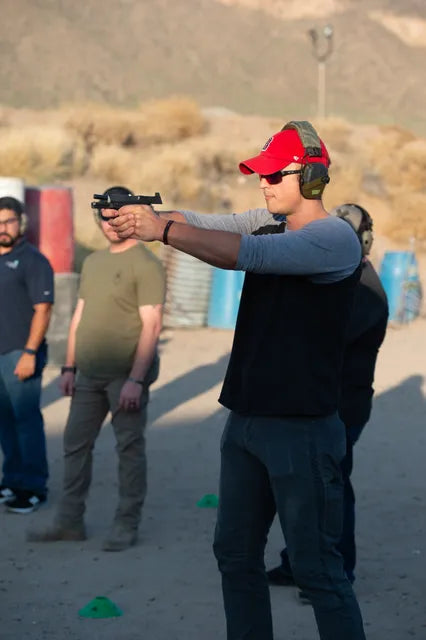 Shooter running a pistol drill at the Stay Ready Training range in Mesa, AZ